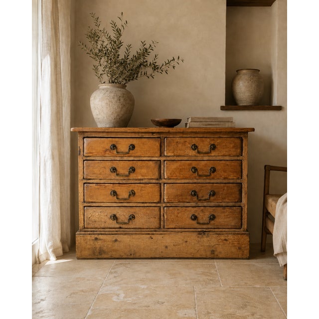 A wonderfully characterful early 19th-century pine bank of eight drawers, distinguished by its unusually fitted interiors...