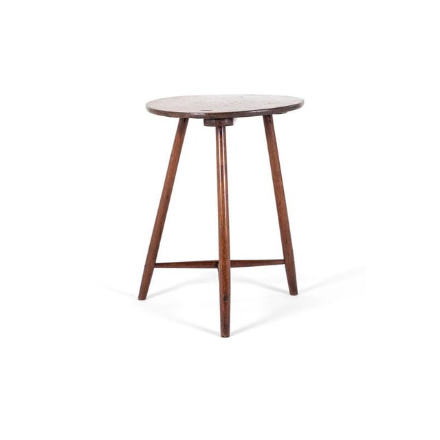 A superb late 18th century cricket table with a wonderfully weathered welsh yew wood top. The splayed legs in oak are...