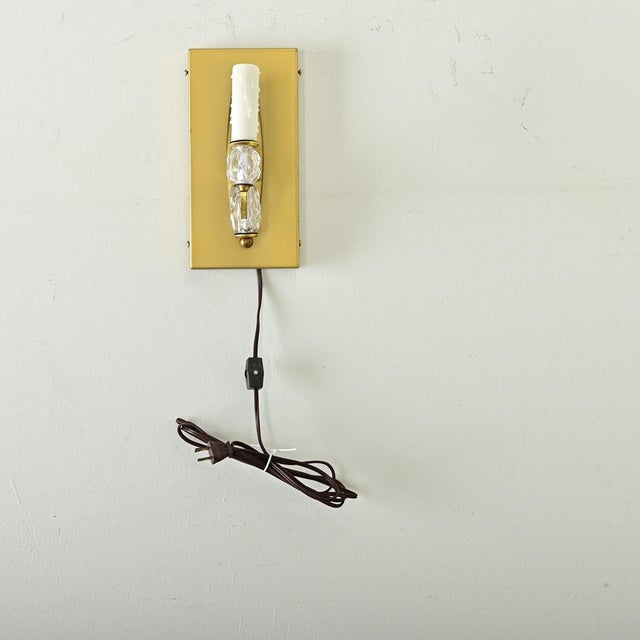 Vintage pair of French wall sconces in brushed brass with both transitional style to mid-century modern appeal. New...