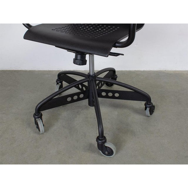 This rare chair is in very good original condition. The seat is made of a solid aluminum. The rest of the frame is made of...