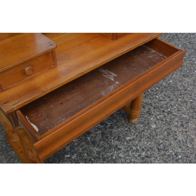 Overall this vanity is in good solid condition. A golden pine in color. 2 top drawers with wooden knobs. Old dovetailing....