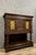 Renaissance-style walnut and oak cabinet circa 1850 it features two wrought-iron openwork doors and a 360° pivoting carved...