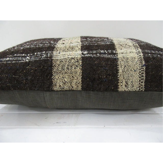 This is a pillow cover made from a vintage kilim rug. The piece was properly washed and ready to use. Pillow inserts not...