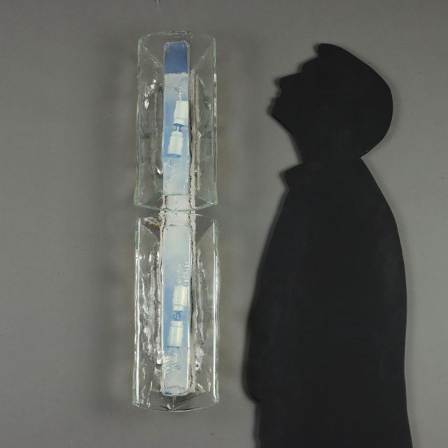 Large wall lamp with enamelled metal and Murano glass frame. This piece is attributed to the mentioned designer/maker. It...