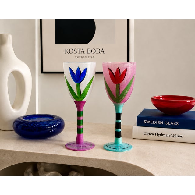 A wonderfully exuberant pair of Kosta Boda “Tulipa” hand-painted art glass goblets by celebrated Swedish artist and...