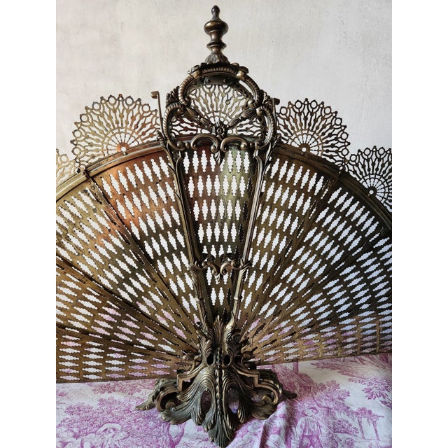 Antique 19th century fire screen, pare-feu, in the form of a peacock's tail, sometimes referred to as a fan fire guard....