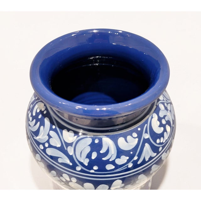 A highly decorative mid-century Italian blue-and-white ceramic apothecary jar, originally used for storing almonds. The...