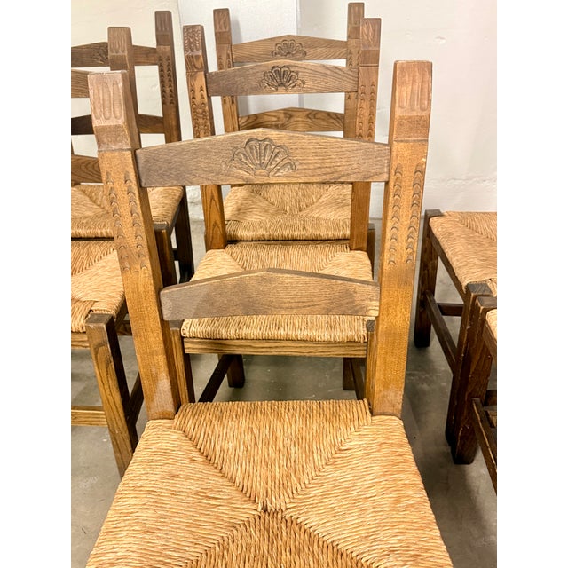 Set of 8 Brutalist dining/lounge chairs handcrafted in Sardinia, Italy. Each chair features hand-carved backrests with...