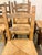 Set of 8 Brutalist dining/lounge chairs handcrafted in Sardinia, Italy. Each chair features hand-carved backrests with...