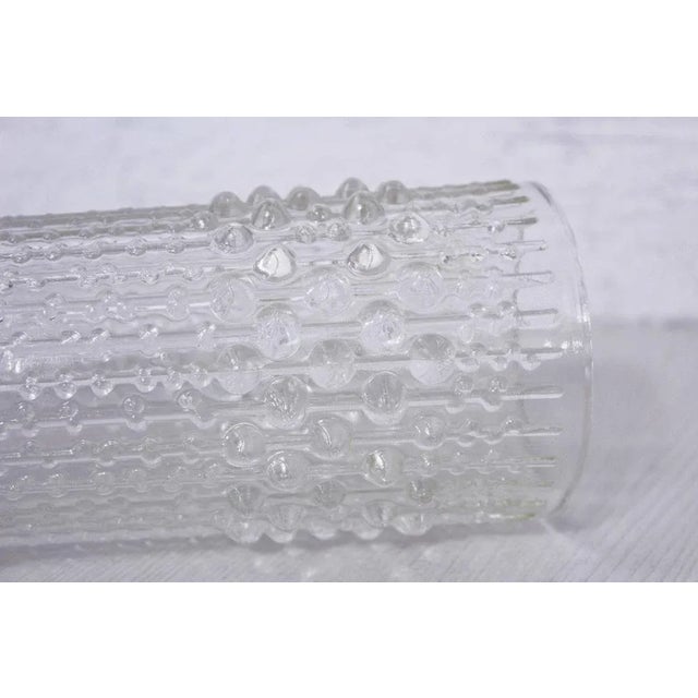 A stunning clear Czech glass "candle wax" vase from the 1970s. Manufactured by the Heřmanova Hut glassworks (part of the...