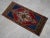 a Vintage Turkish Small yastik rug, blue background yastik rug perfect for entryway, bath or in front of the kitchen sink....