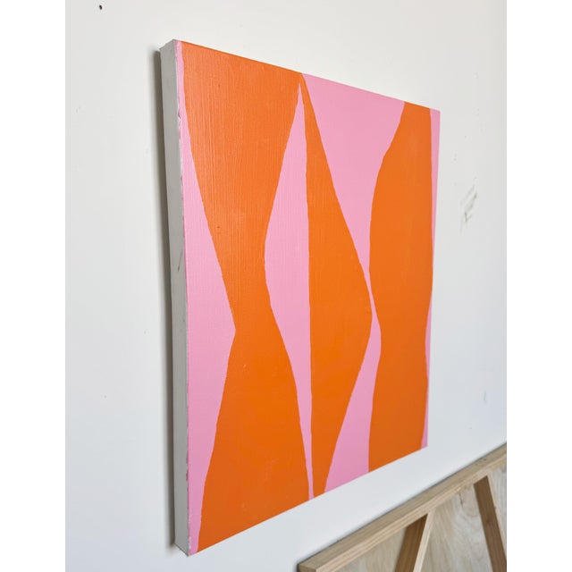 Linger in Warmth is a minimalist abstract painting composed of undulating, flame-like shapes in a vivid tangerine orange,...