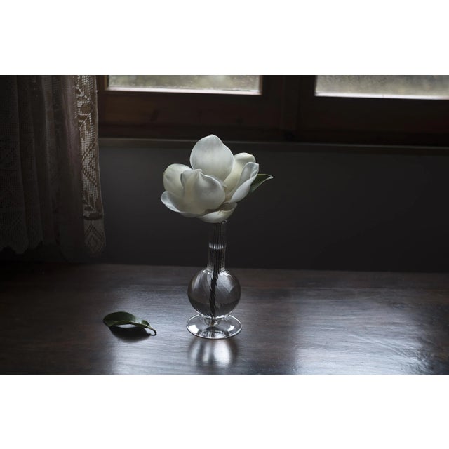 Dervish mini is a borosilicate glass vase masterfully blown in Venice, first designed in 2018. The single vase rests on a...