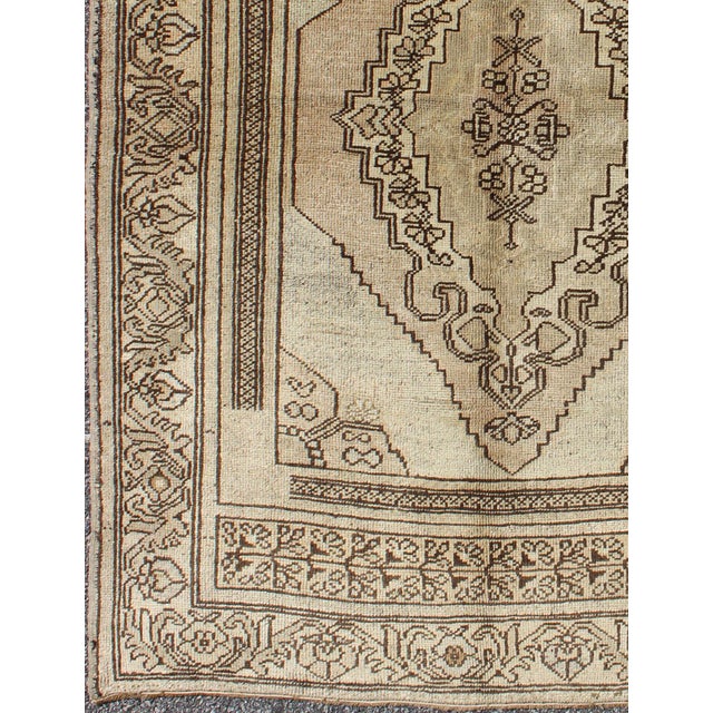 Measures 4 x 5'7 This oushak rug features an intricately beautiful design. The central medallion is complemented by a...