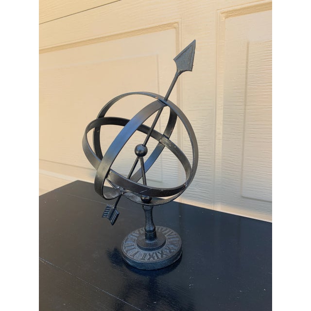 A beautifully crafted iron armillary sphere, evoking the timeless elegance of classical European gardens. Pieces like this...