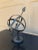 A beautifully crafted iron armillary sphere, evoking the timeless elegance of classical European gardens. Pieces like this...