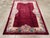 This mid-20th century Chinese Art Deco rug, features a striking composition with a deep burgundy field that exudes warmth...