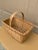 A beautifully woven early 20th century American splint oak basket with warm honeyed tones and a tightly constructed...