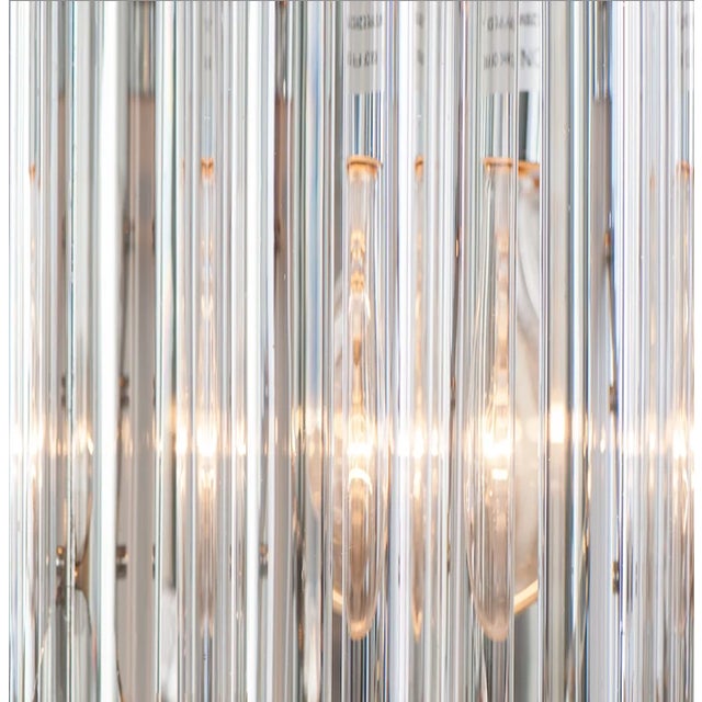 Elevate your interior with the striking elegance of the Triadri WS Sconce. Crafted by Wired Custom Lighting, this luxury...
