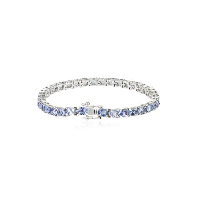 Metal Oval Cut Tanzanite Eternity Style Tennis Bracelet in Sterling Silver For Sale - Image 7 of 11