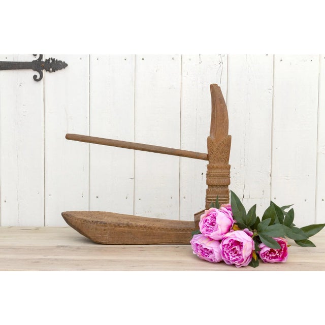 Made from teak, this antique spinning wheel was used to spin cotton into thread. Originally from Thailand, this charming...