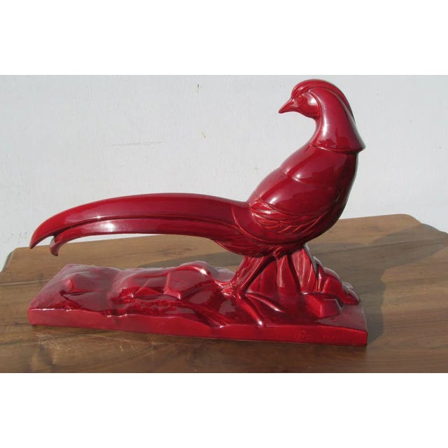 Ceramic Statuette Signed Charles Lemanceau Ceramic Red-Burgundy, France No. 8628, in Good Condition This piece has an...
