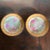 An elegant pair of vintage Royal Munich porcelain cabinet plates featuring romantic pink rose blossoms rendered in soft,...