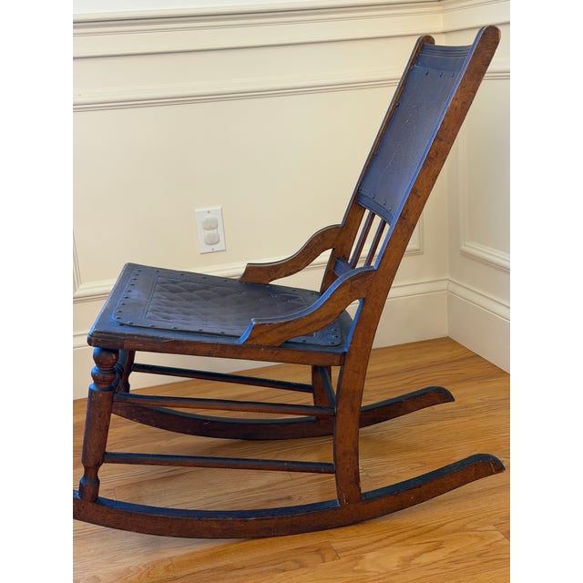 Walnut and leather rocker in original condition from approximately 1900. From an 1850s New England farmhouse that was in...
