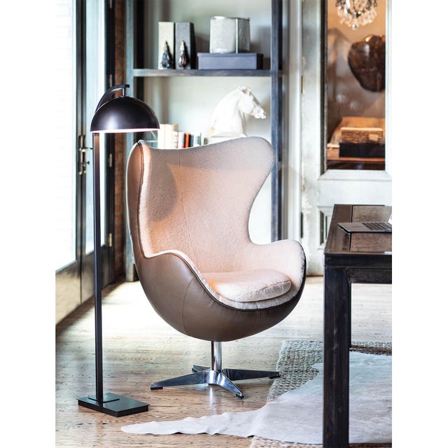 Otto's modern silhouette is accented with sleek design elements like its swiveling, matching metal shade and arching neck....
