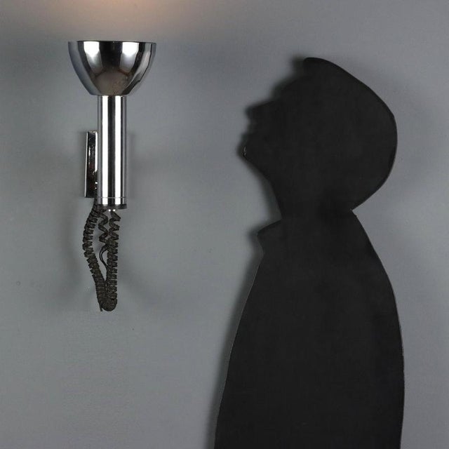 Pair of wall lamps with adjustable diffusers and chromed metal frames. Each lamp has one E27 socket. This piece is...