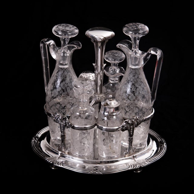 Odiot Paris Cruet Set, 900 Silver Oval base with cross-band decoration, four feet and a central handle, surrounded by...