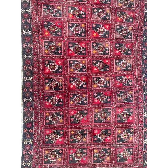 Nice mid century Turkmen Baluch rug with beautiful tribal and geometrical design and nice colours with red, purple,...