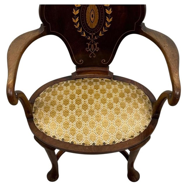 A refined early 20th-century open armchair, crafted from richly figured mahogany in the manner of Cornelius V. Smith and...
