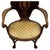 A refined early 20th-century open armchair, crafted from richly figured mahogany in the manner of Cornelius V. Smith and...