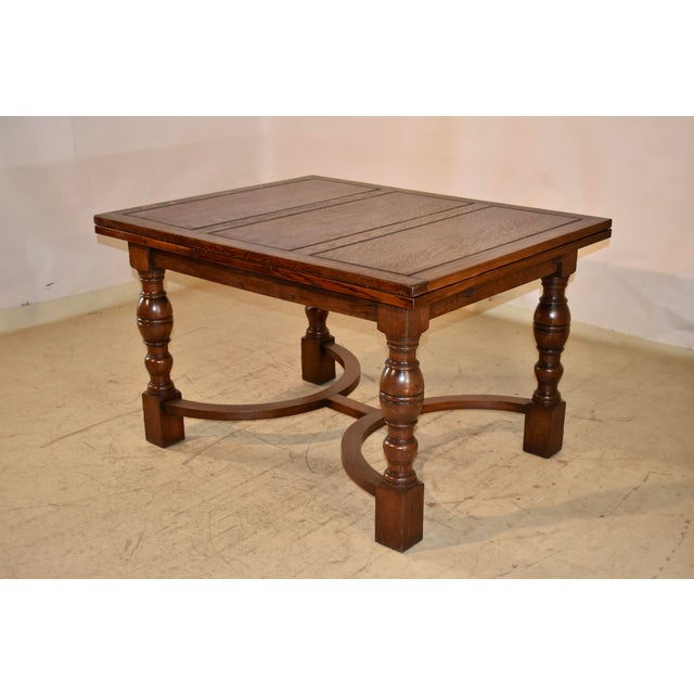 Wonderful paneled top draw-leaf table made from oak and labeled Waring & Gillow. This is a gorgeous table which has a...