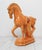 Mid-century ceramic Tang-style Trojan horse figurine. Features a glossy mustard-yellow glaze and a classic draped red...