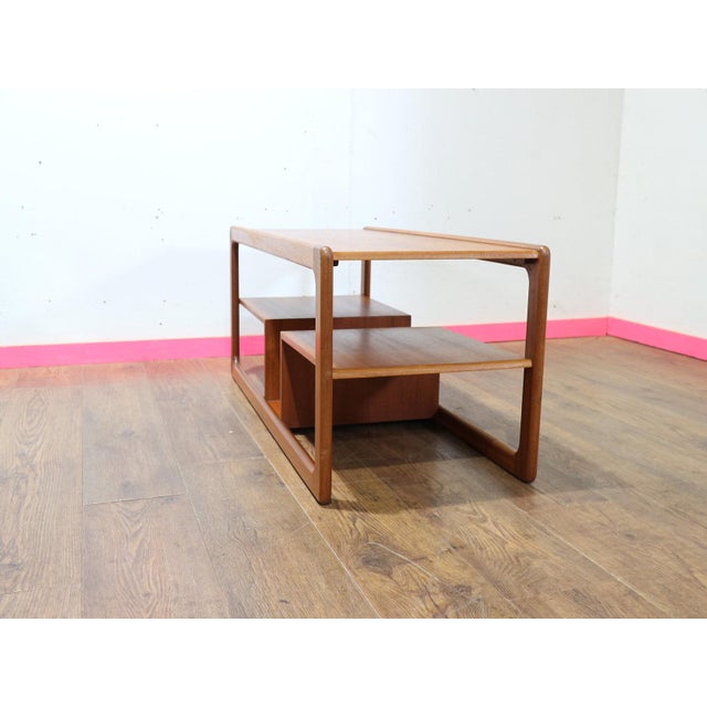 Discover the essence of mid-century elegance with this Vintage Teak Coffee Table by renowned Scottish furniture maker...