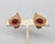 1950s or 1960s textured goldtone with a single cabochon faux-garnet surrounded by small round faux-garnets clip earrings....