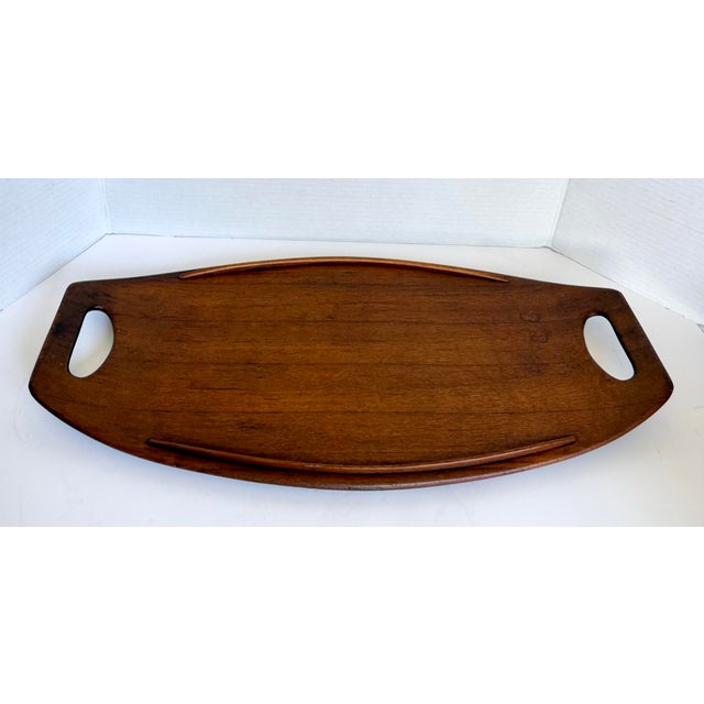 This vintage Dansk Designs serving tray, made in Denmark and dating to the 1960s–1970s, was designed by Danish designer...