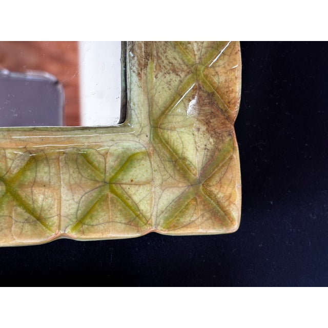 Lovely lattice patterned ceramic mirror set, green with a crackled finish. can be hung vertically or horizontally....