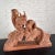 Fabulous antique terracotta life-size sculpture of a pair of handsome squirrels perched on a bent tree branch with leaves...
