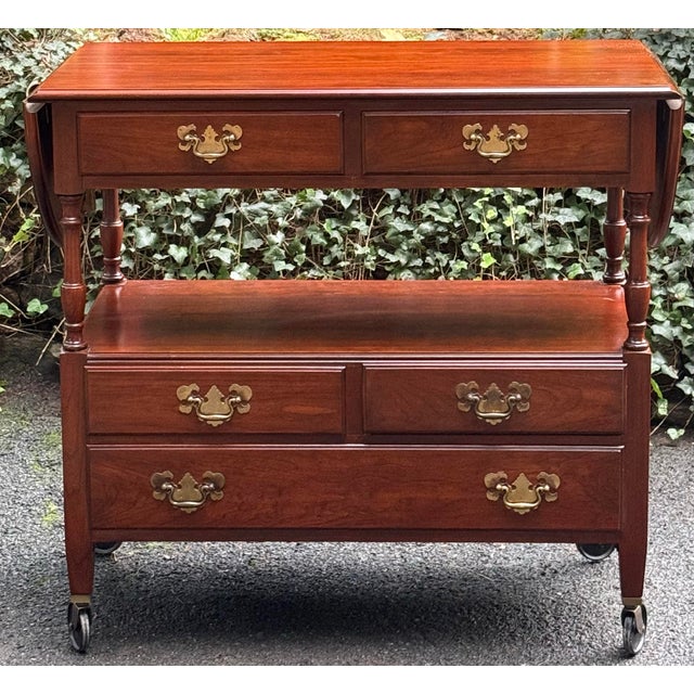 Very nice vintage Pennsylvania House solid cherry drop leaf server. Rich warm patina and engraved brass hardware create an...