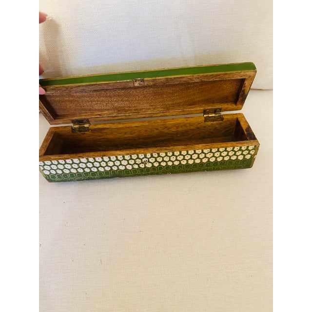 This charming painted box is a useful accessory that will look lovely in any room