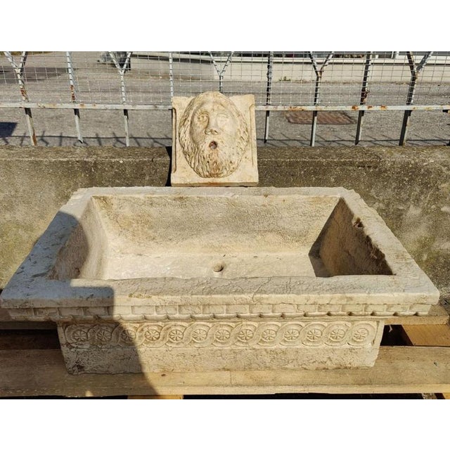 Refined, finely decorated ruby ​​marble sink from Venice, early 20th century. Accompanied by its own mask in the same...