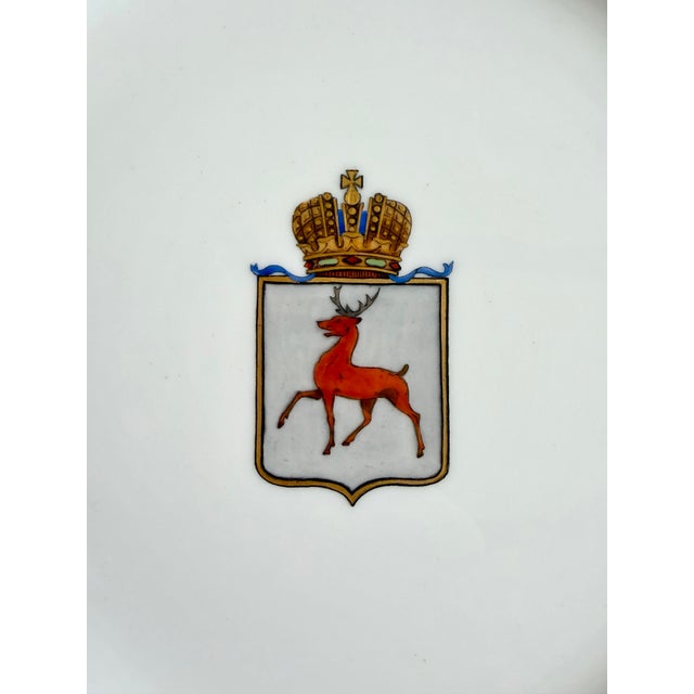 Rare piece of fine imperial Russian porcelain, with a coat of arms featuring a stag and a crown. Signed and numbered on...
