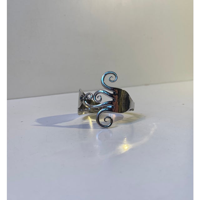 Stylish and organically shaped fork bangle - bracelet made by the danish silversmith j. Thomsen. It splits is two half and...