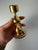 A luxurious highlight of Danish 70s design: This 24-karat gold-plated candlestick by Hugo Asmussen for Asmussen Design...