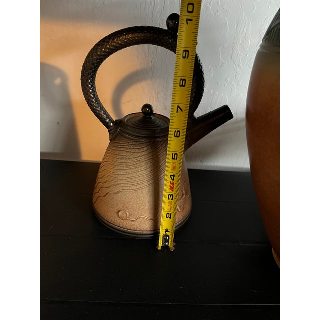 A strong collector lot of 12 pieces by American studio potter Mark Untener, dating to the c. 1990s-2000s. This is a...