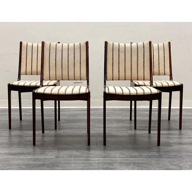A set of 4 good Uldum Mobelfabrik Danish modern dining chairs. The chairs are well made and the rosewood is hefty and of a...