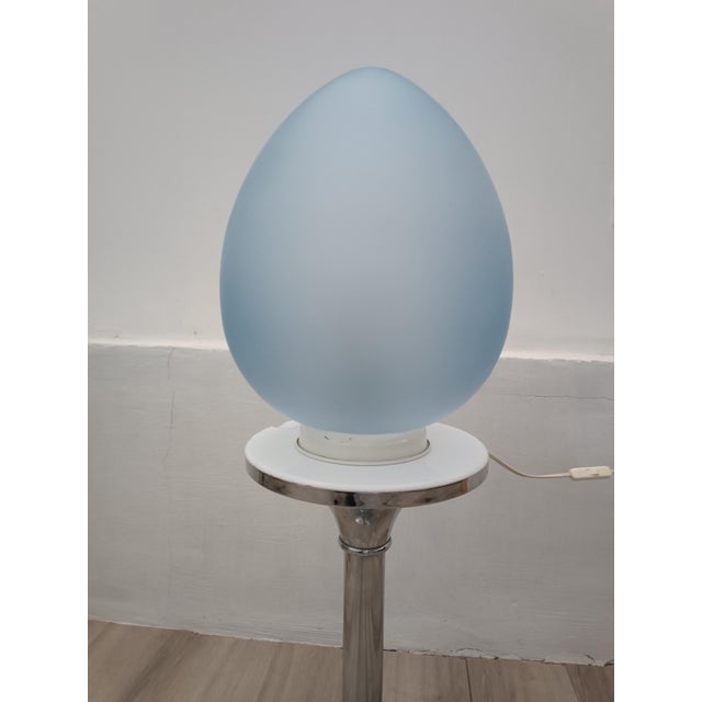 Beautiful Egg Lamp 5178 by Siba. France, 1980s. White lacquered metal base. Large opaque sky-blue glass globe. It is truly...